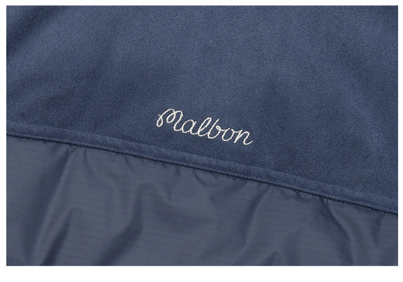 Malbon women's knit hybrid insulated down golf jacket in Navy Blue, branding detail