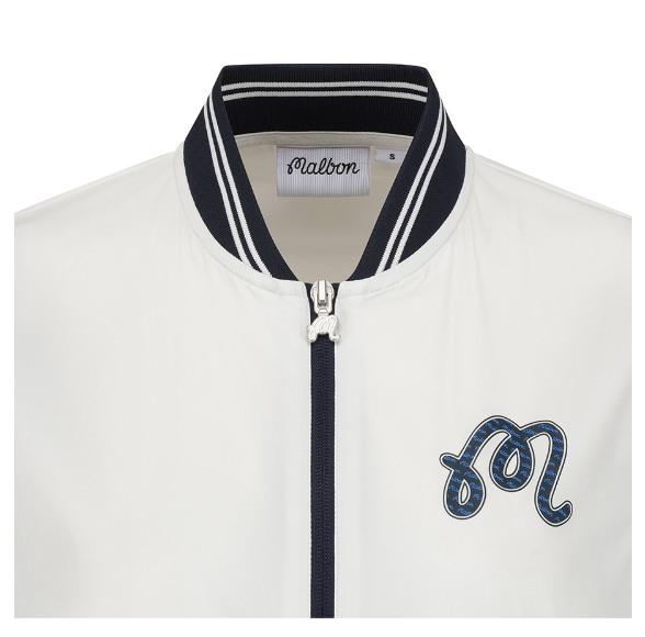 Malbon women's stand collar lightweight breathable golf jacket in Navy Blue, collar and logo detail
