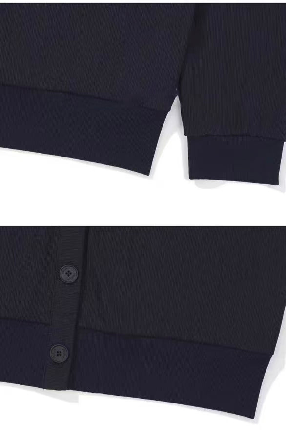 Black Malbon golf sweatshirt sleeve and button detail