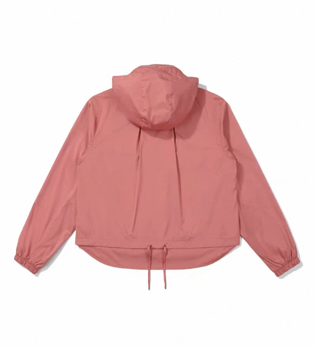 Back view of pink Malbon women's hooded golf wind jacket
